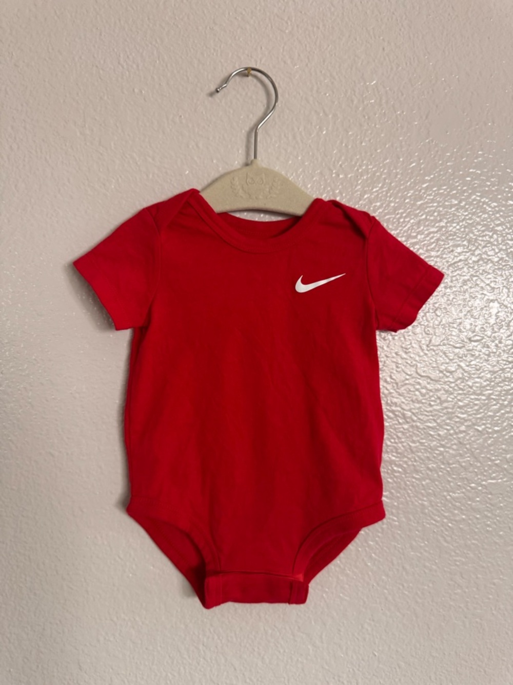 Nike Red Infant One-Piece Bodysuit with White Swoosh